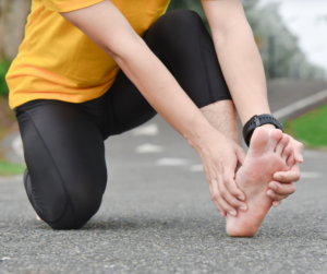 runner holding foot